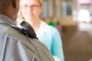 Police officer who is talking to teacher on campus