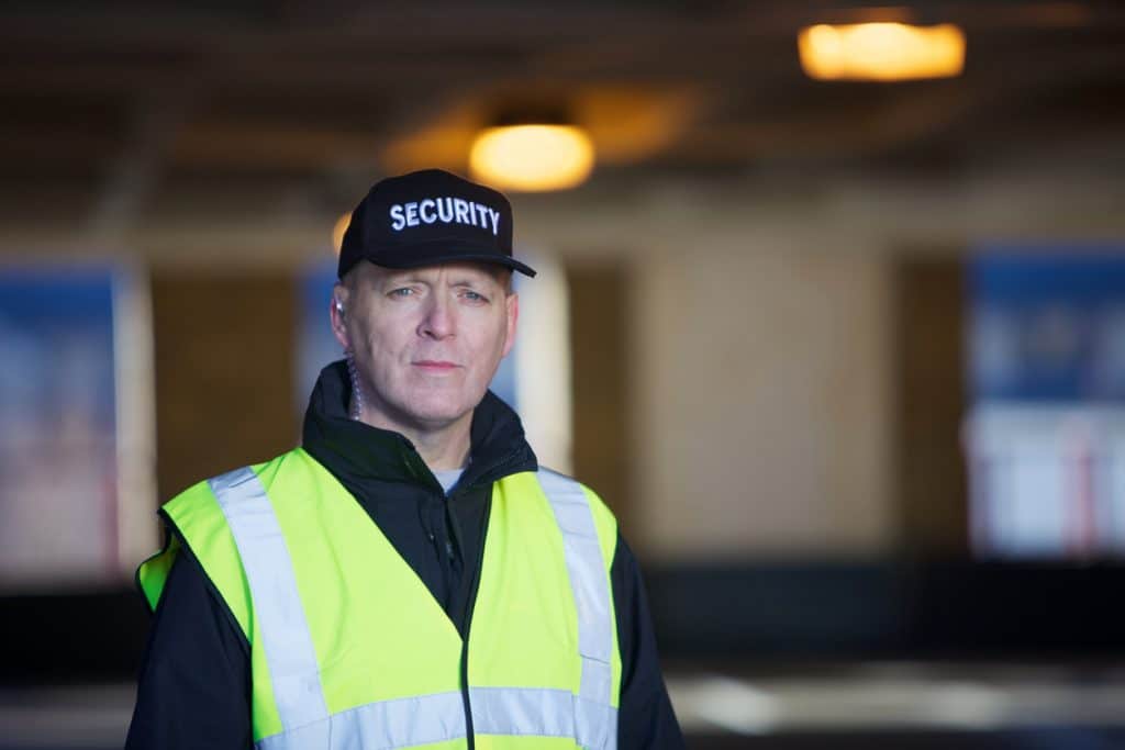 Security guard with black cap