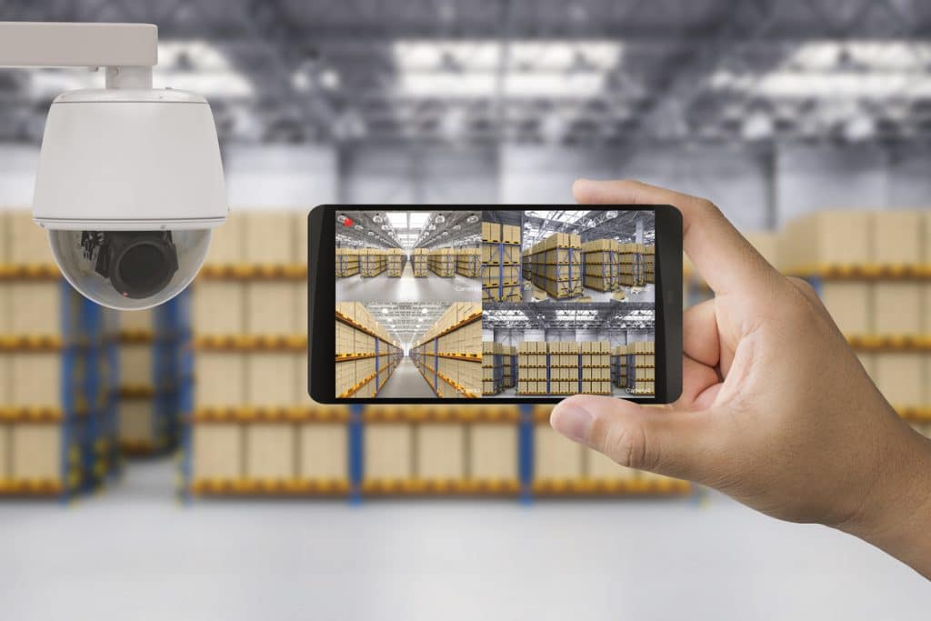 A CCTV camera and remote monitoring via smartphone for warehouse security measures implemented by a Calgary security company.