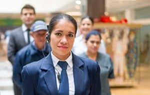 Security guard with a group of workers at a shopping mall