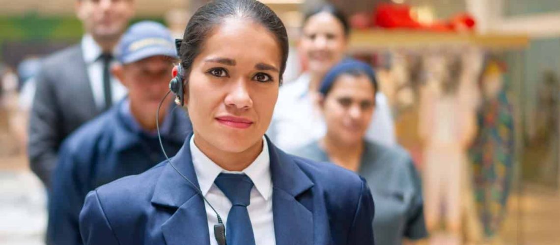 Security guard with a group of workers at a shopping mall